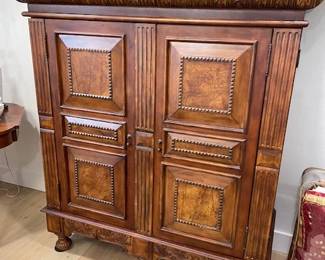 Carved mahogany door cabinet.  Can be used as an entertainment center, a china/storage cabinet or updated to a bar cabinet.