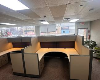 Six 180 degree cubicles (8'x6') with overhead storage, under lighting, and file cabinets.