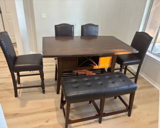 Dinning Tables 4 chairs and a                      Table: 62"L 40"W 36"T                                                                                     Chairs: 20"W 20"D 44"T                                                                                  Bench: 40"W 17"D 24"T