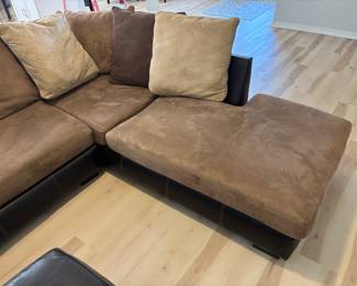 2 pc Sectional Sofa Browns faux leather and suede with ottoman. $ 450.00   (1) Sofa: 90"L 36"D 26.5"T   (2) Sofa: 80"L 36"D 26.5"T Pillow back, Ottoman: 42"x 42" x 17"