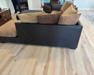 2 pc Sectional Sofa Browns faux leather and suede with ottoman. $ 450.00   (1) Sofa: 90"L 36"D 26.5"T   (2) Sofa: 80"L 36"D 26.5"T Pillow back, Ottoman: 42"x 42" x 17"