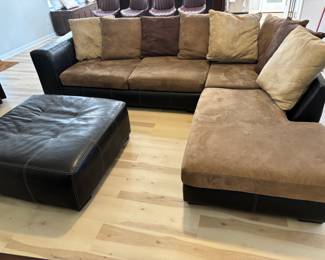 2 pc Sectional Sofa Browns faux leather and suede with ottoman. $ 450.00   (1) Sofa: 90"L 36"D 26.5"T   (2) Sofa: 80"L 36"D 26.5"T Pillow back, Ottoman: 42"x 42" x 17"