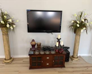 (2) Wooden columns with pot and arrangement $125.00 each
TV stand storage and home decor