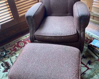 One of a pair of comfy occasional chairs with ottomans