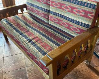 Nice settee with Native American patterned upholstery fabric.
