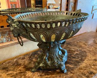 VERY HEAVY iron urn with lion head ornamentation on either end.  Light green patina.