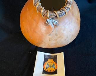 One of several decorated Native American painted gourds.  Signed by the artist.