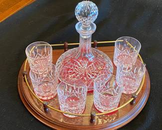 Waterford decanter set with sweet wooden base and rail.