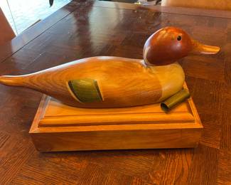 Fine wooden men's treasure/trinket box.   The duck on the lid is decoy sized...great for hiding goodies, loose change, glasses, business cards, cigars, or whatever you choose.