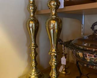 Pair of tall brass candlesticks.