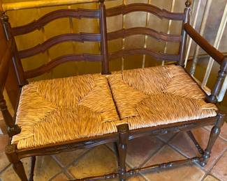 Vintage settee with rattan seats.  Great condition.