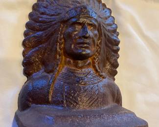 This  vintage iron Indian is one of a pair of bookends.
