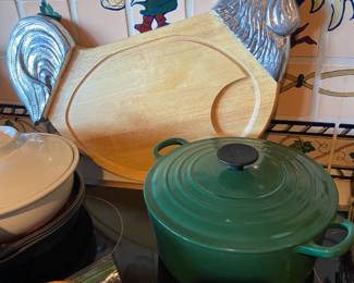 Cute chicken cutting board and Le Creuset stock pot.