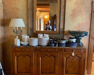 Gorgeous marble topped buffet by Century Furniture Co.  Centered behind the buffet is an absolutely stunning beveled mirror.  The dishes stacked on top are part of a large Lenox set.
