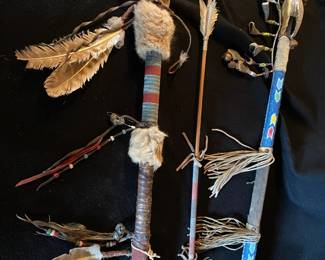 You won't find these just anywhere!  These rods/spears have beadwork, skins, and skulls for adornment.