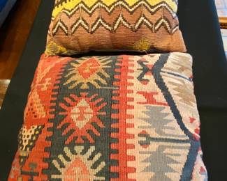 Several more colorful throw pillows.