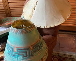  A pair of Native American style lamp shades.  The larger one is a cow hide shade.