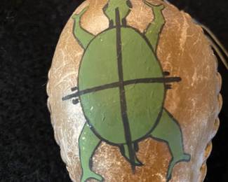 This is a detail of the head of a Native American rattle made of cow skin.