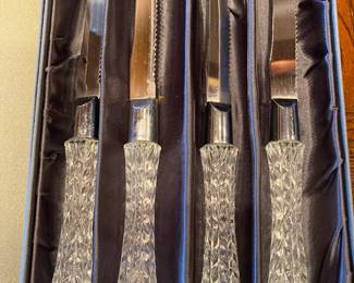 One of several boxes of identical Waterford steak knives.
