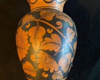 Lovely pottery vase with floral design.