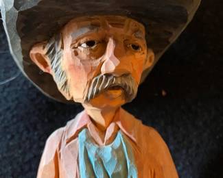 Carved wooden cowboy figure