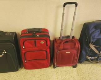 Many apologies, our client removed the Burgundy Suitcase after pics were taken. It is not for sale.