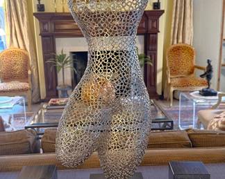 Nude sculpture built from nuts and bolts.  It’s pretty awesome!