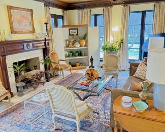 The living room.  It’s totally incredible!  Filled to the brin with antiques, rugs and designer furniture