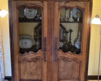 Antique French Country armoire with chicken wire cabinet front