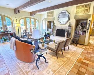 The amazing den! Unfortunately, the custom area rug is not for sale.