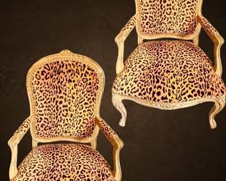 Pair of carved French armchairs with leopard upholstery