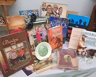 Hardbacks and paperback books from two different estates