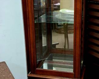 Several lighted curio display cabinets