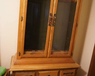 glass door gun cabinet--you can repurpose into a quilt cabinet!