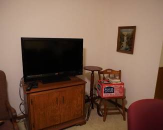 TV, TV cabinet, chair, VHS