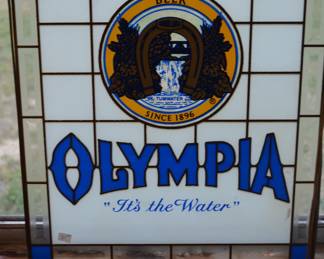 Glass Olympia advertising sign