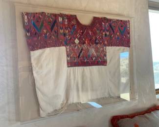 Vintage huipil in acrylic display case