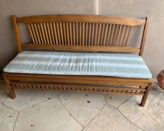 Garden bench with cushion
