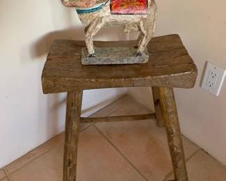 Indian cow figurine on vintage stool