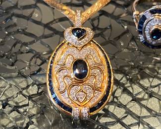 A fine 18k sapphire and Diamond enhancer pendant.