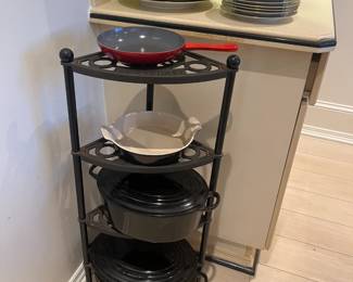 Le Creuset 5 tier corner rack, #35 dutch oven, #31 dutch oven, #22 casserole dish, and #8 pan