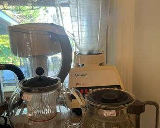 Small kitchen appliances: Brita pitcher, blender, coffee carafes