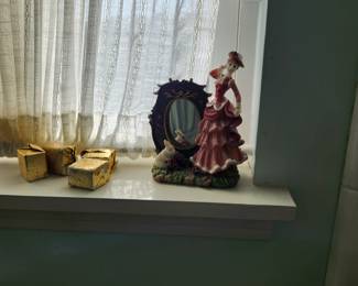 Collectible lady on mirror