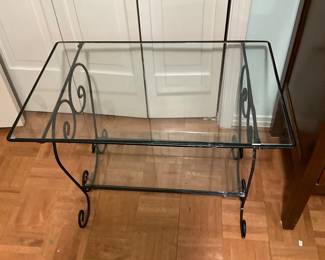 Glass top table with metal