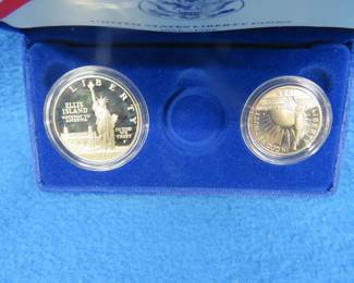 Lot 98. 1986 Proof Liberty 90% silver dollar weighing 26.73 gr., and a 1986 Proof copper/nickel half dollar. No gold coin.