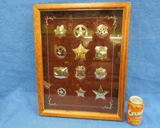 Lot 349. Reproduction Old West badges made out of sterling silver in an oak presentation case. Total weight of badges is 233 grams.