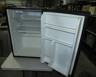 Lot 281. Dorm room refrigerator in excellent condition.