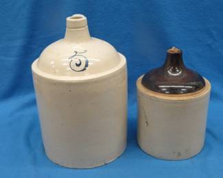 Lot 132. Unidentified 5-gallon stoneware jug in excellent condition and an unmarked 2-gallon stoneware jug in excellent condition.