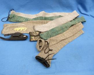 Lot 128. Four gun socks, a shell holder, and a holster