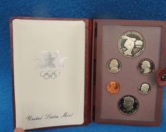 Lot 95. 1983 Olympic Prestige Set including a silver dollar containing 90% silver dollar weighing 26.73 gr.